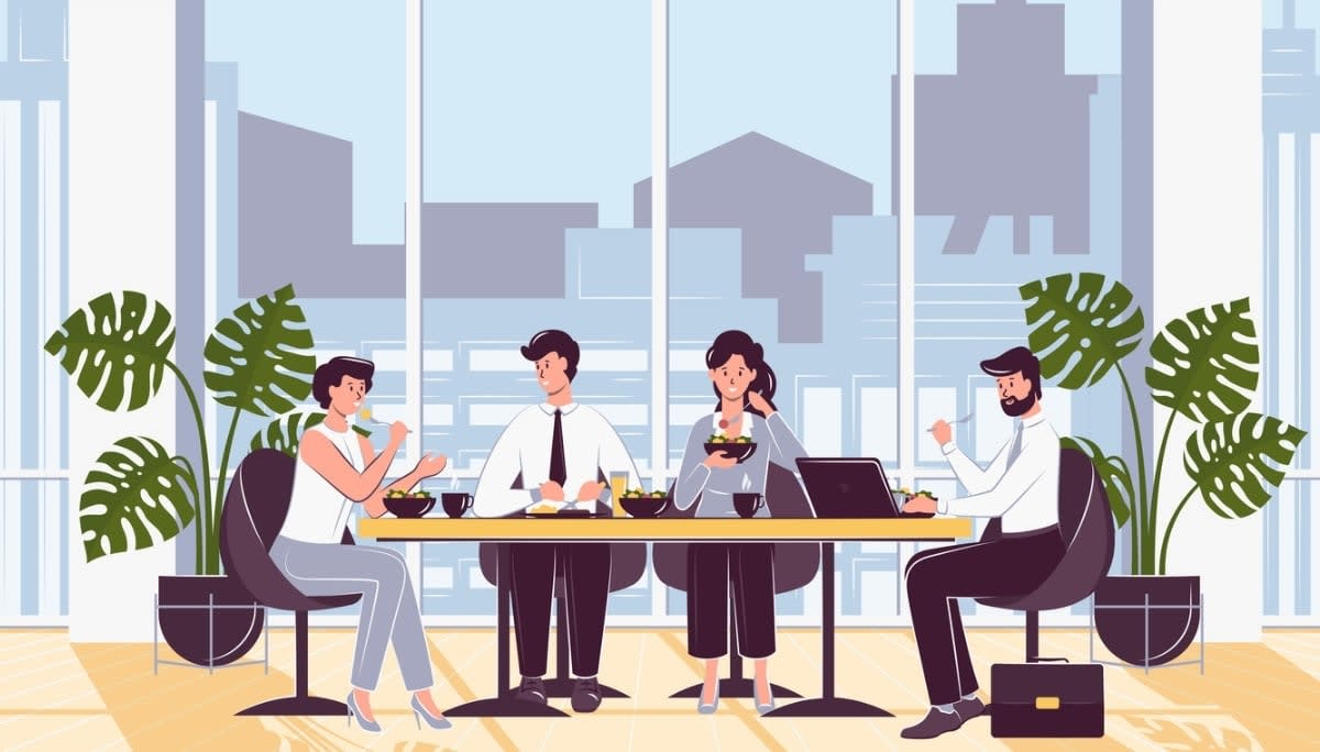 Illustration of four office workers sharing a meal around a table with salads, drinks, and a laptop.
