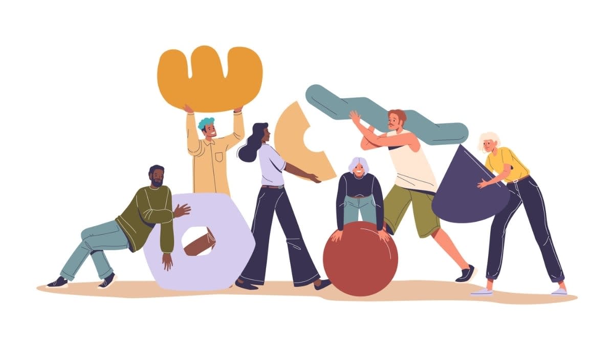 A diverse group of six people interacting with oversized, colorful geometric shapes, symbolizing playful collaboration, creativity, and authentic connection in small group team-building activities.