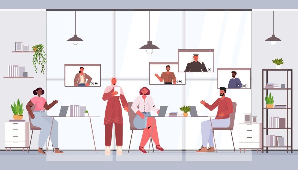 Hybrid office meeting with in‑person and remote participants, symbolizing event planning and collaboration software.