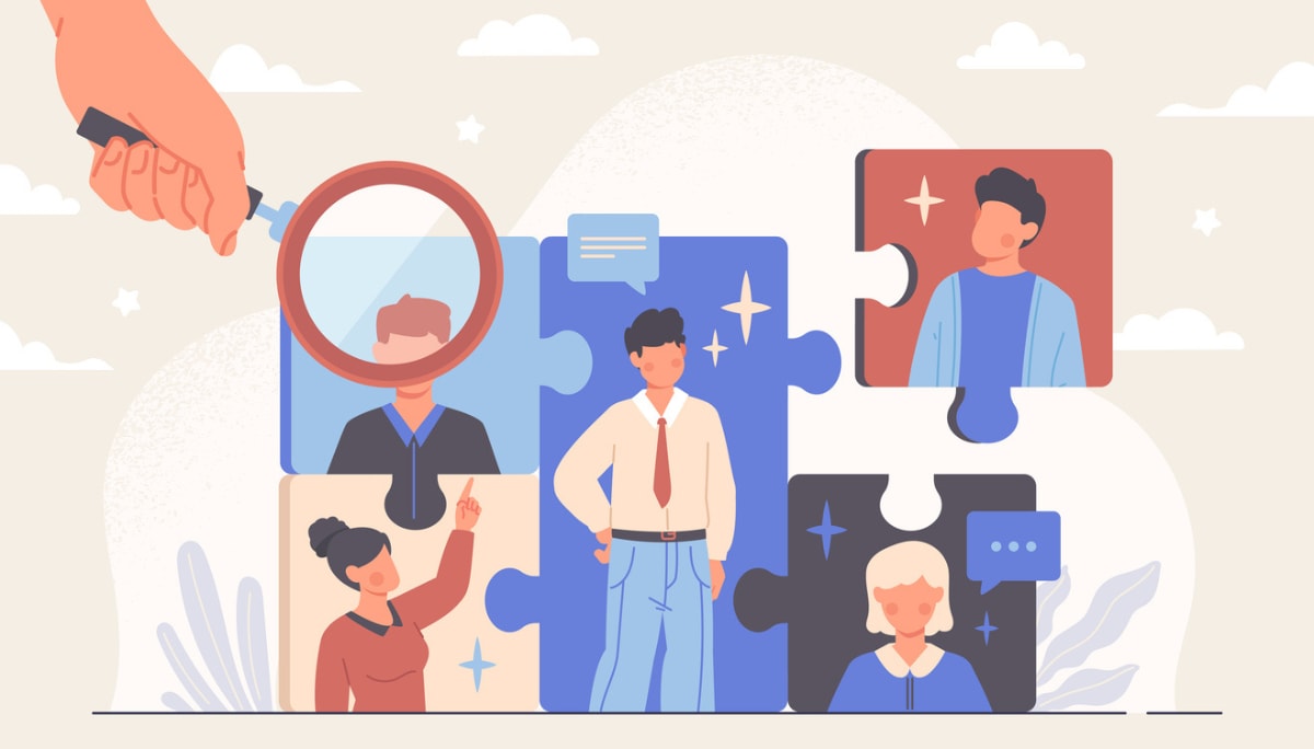 Illustration of puzzle pieces with people and magnifying glass, symbolizing fun team meeting games and collaboration.