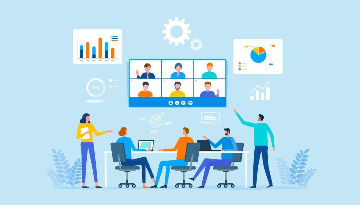 Office meeting combining onsite and remote workers, representing proximity bias impact on teamwork.