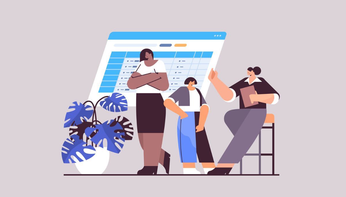 Illustration of team members discussing work in front of a large digital table interface, representing collaboration and team management software.