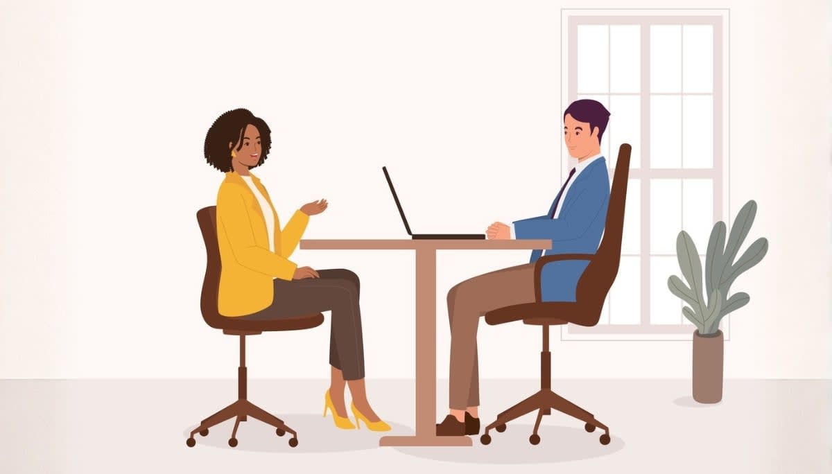 Illustration of two professionals seated across a desk in a modern office.