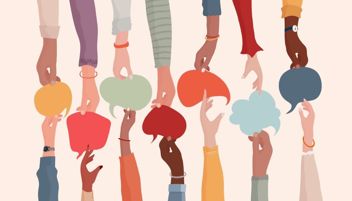Illustrated hands of different backgrounds raising speech bubbles, representing workplace communication skills.