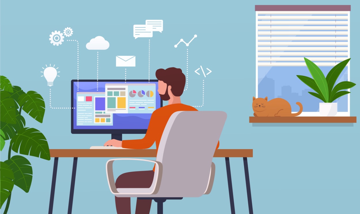 Person working at a desk with charts and cloud icons on screen, representing computer screen monitoring software and desktop activity tracking.