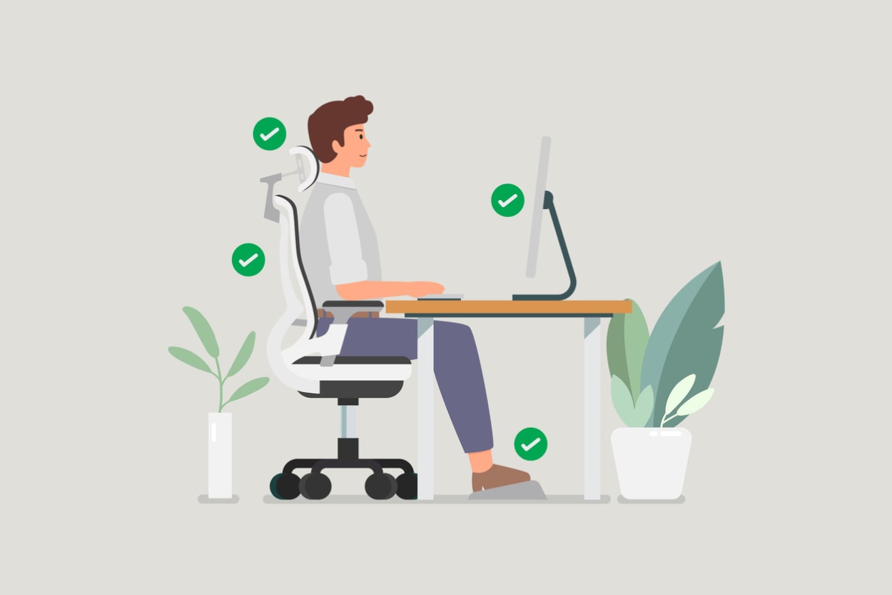 Person seated in an ergonomic office chair with proper posture, lumbar support, and eye-level monitor setup.