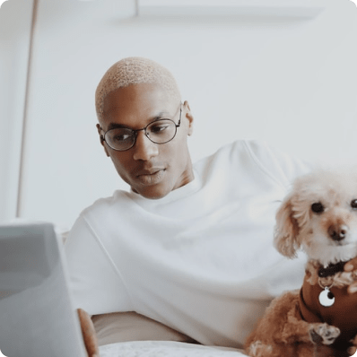 person-on-computer-with-dog