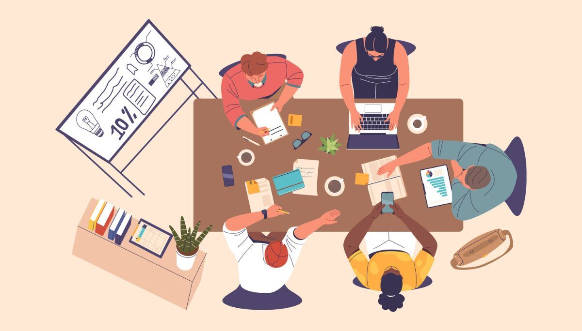 Overhead view of a team collaborating around a table with documents, laptops, and a whiteboard, symbolizing project planning and template creation.