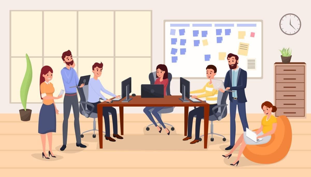 Modern workspace with employees working on computers and sticky note board, representing PMO functions and teamwork.