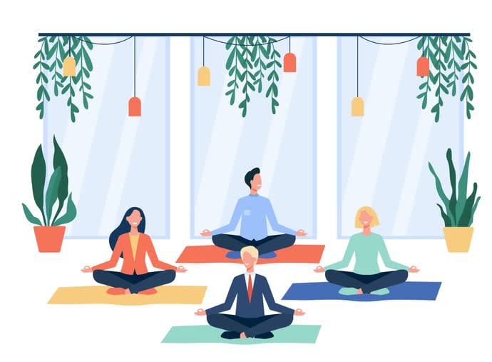 Happy office workers doing yoga