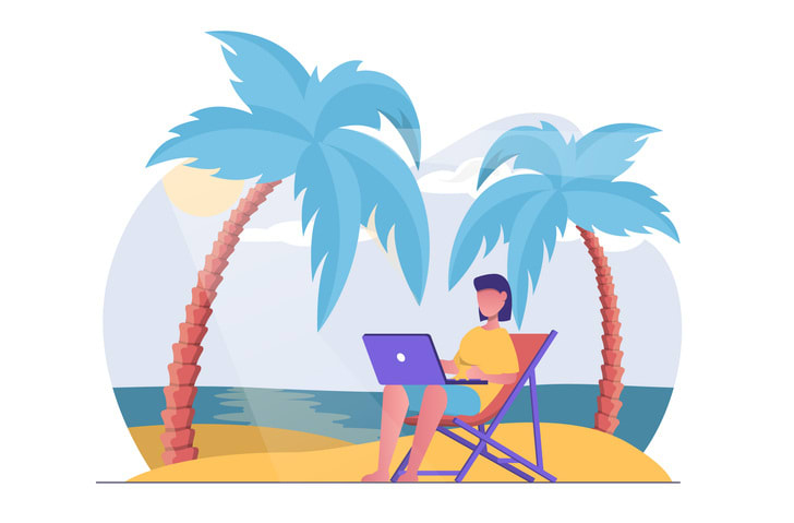 Female freelancer on the beach working on a laptop