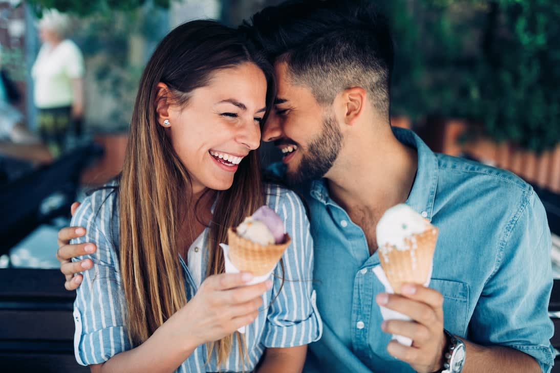 couple holding ice cream 